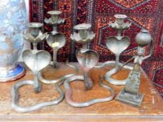 Four brass Indian cobra candlesticks & a brass fig