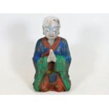 A Chinese carved wooden polychrome figure Buddha f