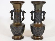 A pair of Japanese bronze vases with dragon decor