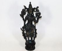 A Chinese bronze deity 13.25in high. Provenance: b