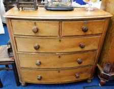 A Victorian bow fronted chest of drawers, some fau