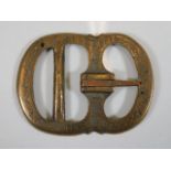 A bronze buckle indistinctly inscribed Pok Grimsso