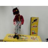 A Pelham puppet figure with box