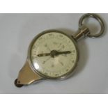 A pocket size compass & map gauge