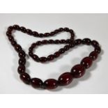 A set of cherry amber style beads approx. 59g