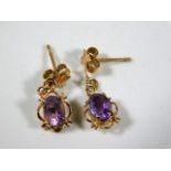 A pair of 9ct gold amethyst earrings