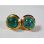 A pair of 14ct gold earrings set with natural turq