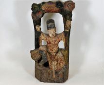 A Chinese polychrome carved wood figure depicting