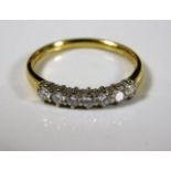 An 18ct gold ring set with seven diamonds 2.4g siz