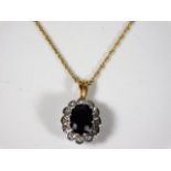 A 9ct gold necklace with sapphire & diamond pendan