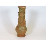 A Chinese earthenware part glazed vase depicting d