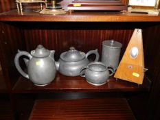A Tudric pewter service, one other pewter pot & a