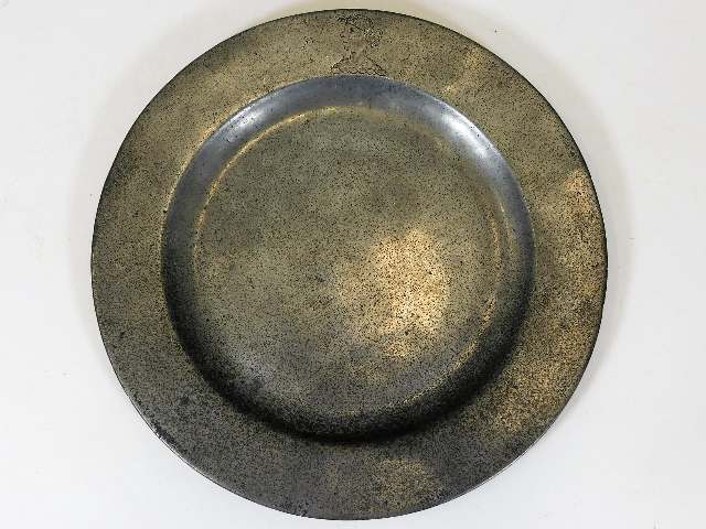 A 19thC. pewter dish with Americana head stamp