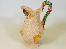 A Clarice Cliff pink Celtic Harvest jug 8.5in high