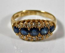 An 18ct gold ring set with sapphire & diamonds 4.4