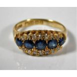 An 18ct gold ring set with sapphire & diamonds 4.4