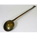 A Georgian brass ladle 16in long