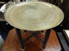 A small brass Benares table