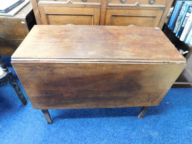 An early 19thC. oak drop leaf table, some faults