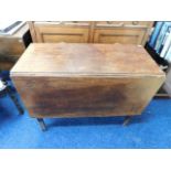 An early 19thC. oak drop leaf table, some faults