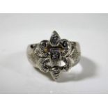 An 18ct white gold fleur de lys ring set with diam