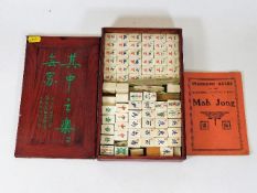 A Chinese bone & bamboo mahjong set