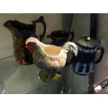 Two copper lustre jugs, a pottery chicken jug & a