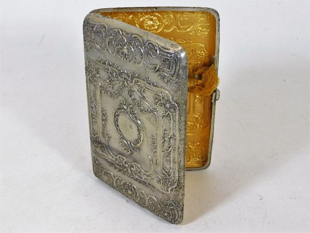 A white metal with gilt lined interior embossed cigar case