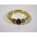 A yellow metal ring, tests at 18ct gold, set with