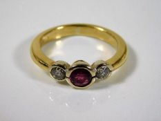 A yellow metal ring, tests at 18ct gold, set with