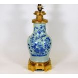 A Chinese vase later converted to lamp base fitted