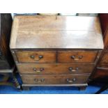 A George III oak bureau, some faults