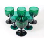 Six 19thC. green wine glasses 4.625in high, two ha