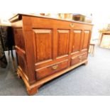 An 18thC. oak mule chest with drawers under, some