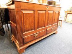 An 18thC. oak mule chest with drawers under, some
