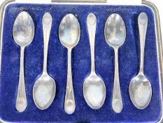 A small set of six silver teaspoons