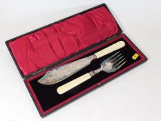 A cased silver plated fish knife set