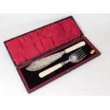 A cased silver plated fish knife set