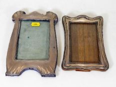 Two silver photo frames, one lacking stand