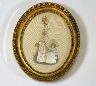 A gilt framed oval silk picture 7in at widest inc.