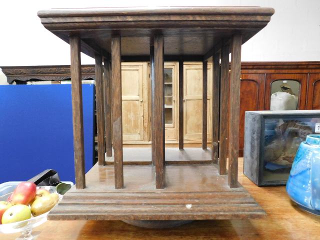 A small oak rotating bookshelf