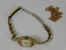 A 9ct gold cased watch twinned with a 9ct gold cha