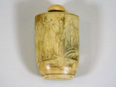 A Oriental bone snuff bottle with etched decor 2.7
