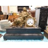 A 19thC. figurative French gilt clock with slate s