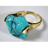 An 18ct gold cocktail ring set with turquoise 9.1g size N/O
