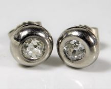 A pair of white metal diamond earrings approx. 1ct