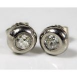 A pair of white metal diamond earrings approx. 1ct