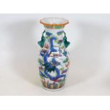 A 20thC. Chinese porcelain vase with dragon decor