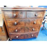 A Victorian bow fronted chest of drawers