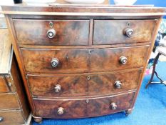 A Victorian bow fronted chest of drawers